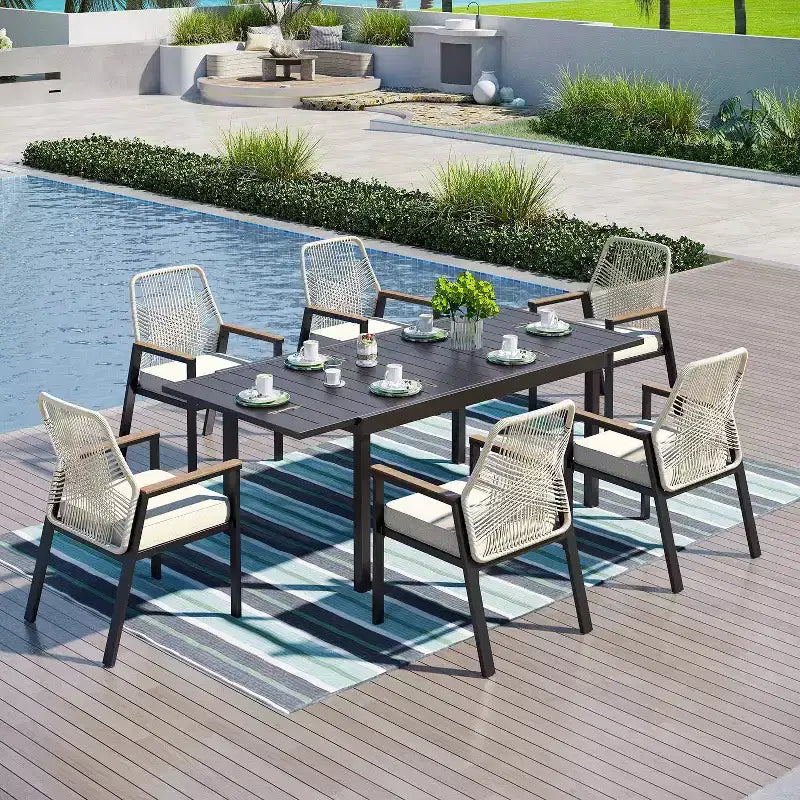 Captiva Designs 7-teilige Terrassen-Essgruppe mit ausziehbarem Stahltisch und drehbaren Korbgeflechtstühlen mit dicken Sitzkissen