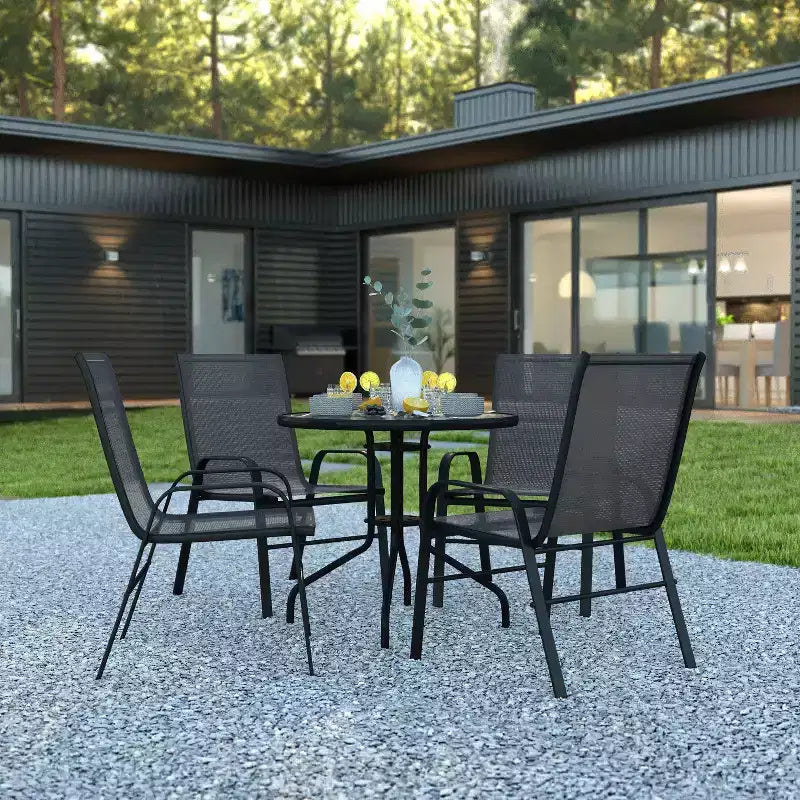 Emma and Oliver Five Piece Patio Table Set with Round Metal Table with Tempered Glass Top and 4 Flex Comfort Stacking Chairs