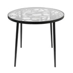 LeisureMod Devon 5-Piece Outdoor Dining Set - Round Glass Table with 4 Black Flower Design Stackable Chairs