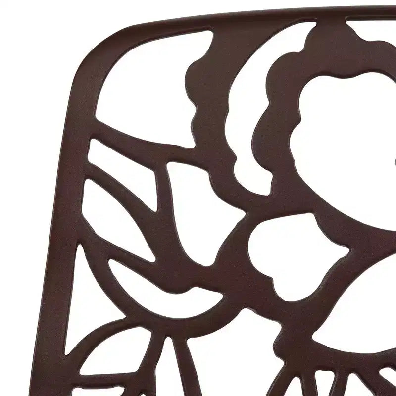 LeisureMod Devon 5-Piece Outdoor Dining Set - Round Glass Table with 4 Black Flower Design Stackable Chairs