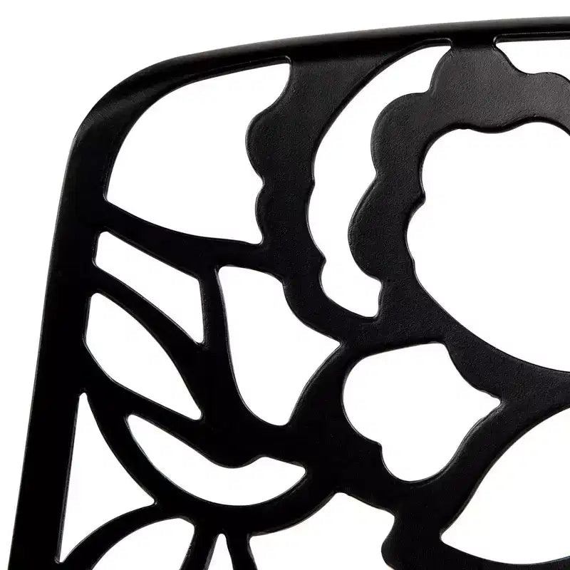 LeisureMod Devon 5-Piece Outdoor Dining Set - Round Glass Table with 4 Black Flower Design Stackable Chairs