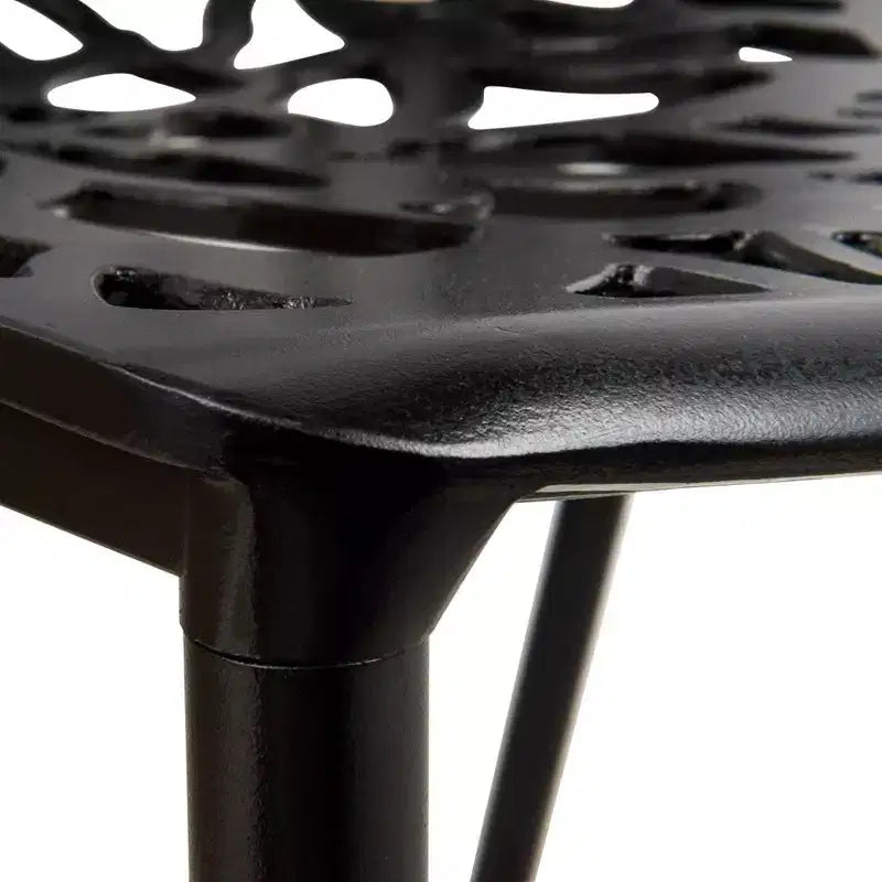 LeisureMod Devon 5-Piece Outdoor Dining Set - Round Glass Table with 4 Black Flower Design Stackable Chairs